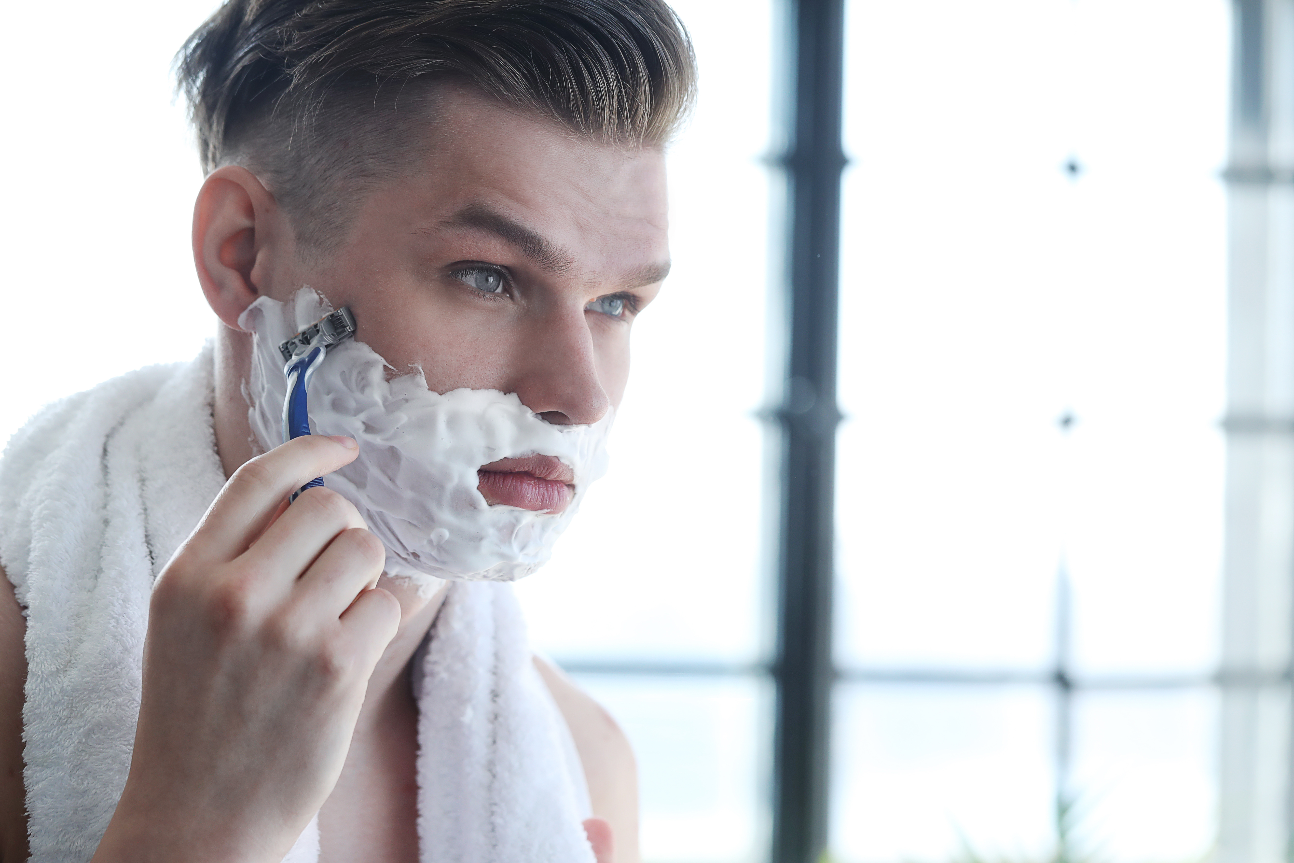 A man shaving with Gillette's razor