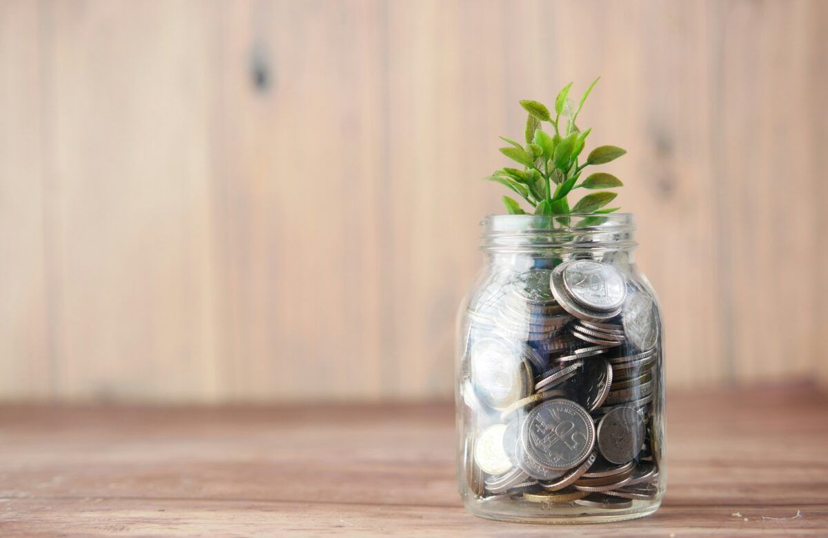 Showing a concept of Savings, coins in Jar